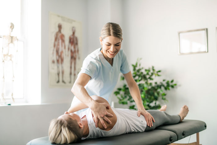 modern-rehabilitation-physiotherapy-worker-with-woman-client